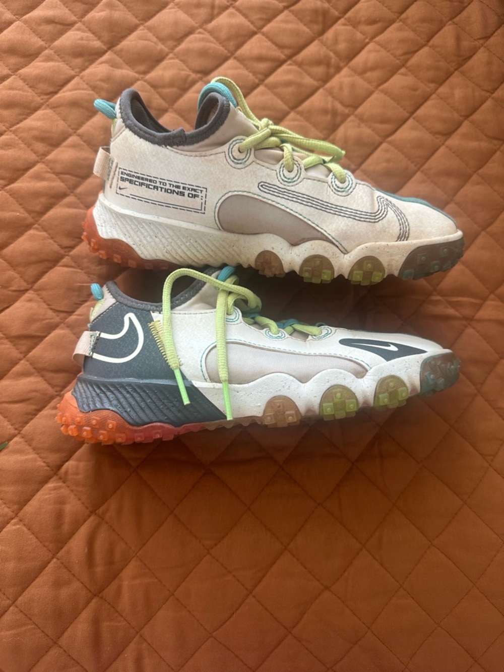 Nike Kids White and Gray Cleats with Lime and Teal Accents